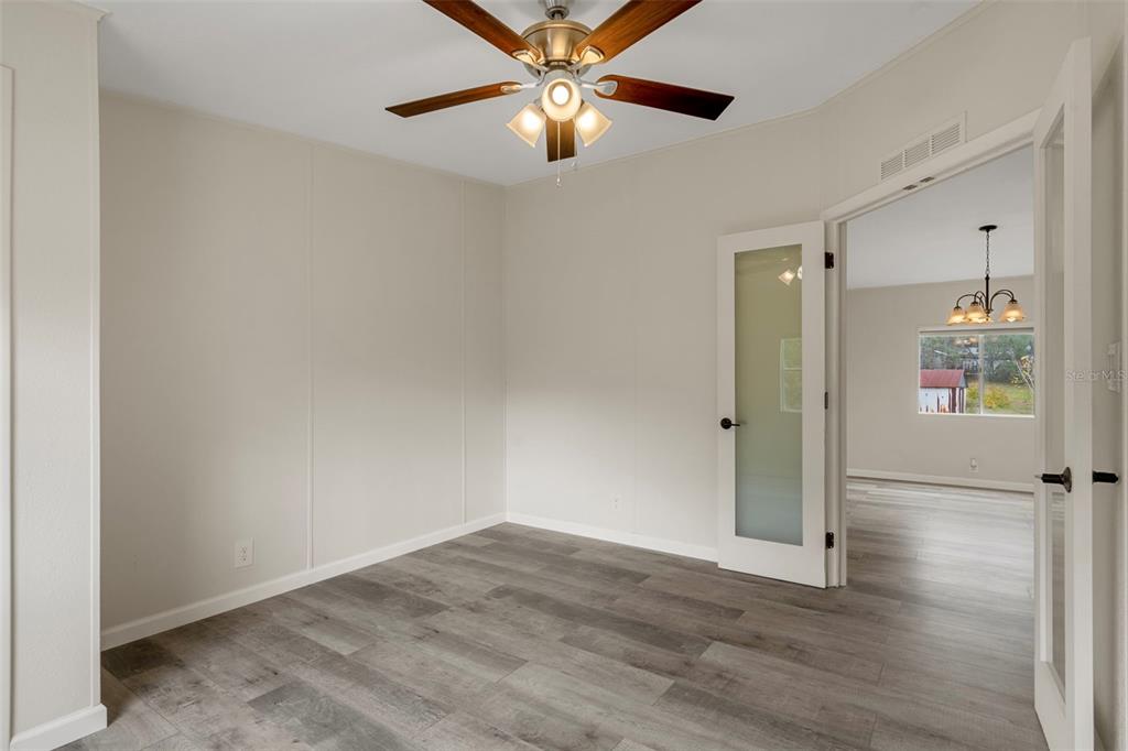 18008 Greensboro Street Spring Hill, FL 34610 - Photo 26 of 49 a view of empty room with wooden floor