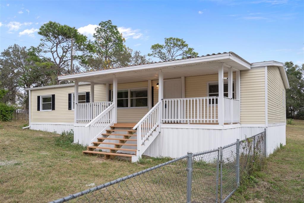 18008 Greensboro Street Spring Hill, FL 34610 - Photo 3 of 49 a view of a house with a balcony