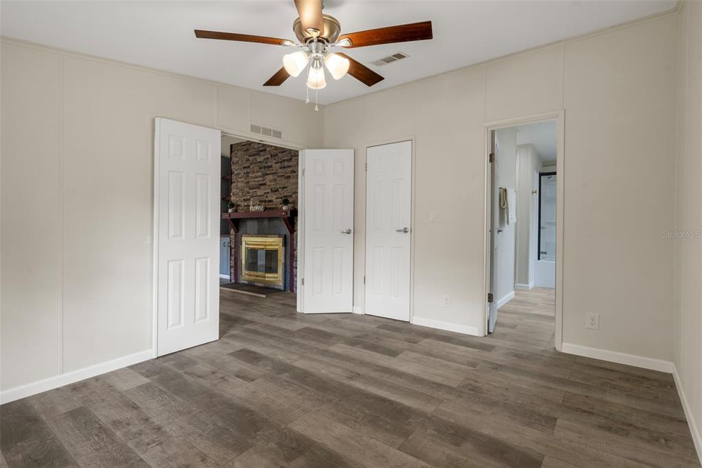 18008 Greensboro Street Spring Hill, FL 34610 - Photo 31 of 49 an empty room with closet and a ceiling fan