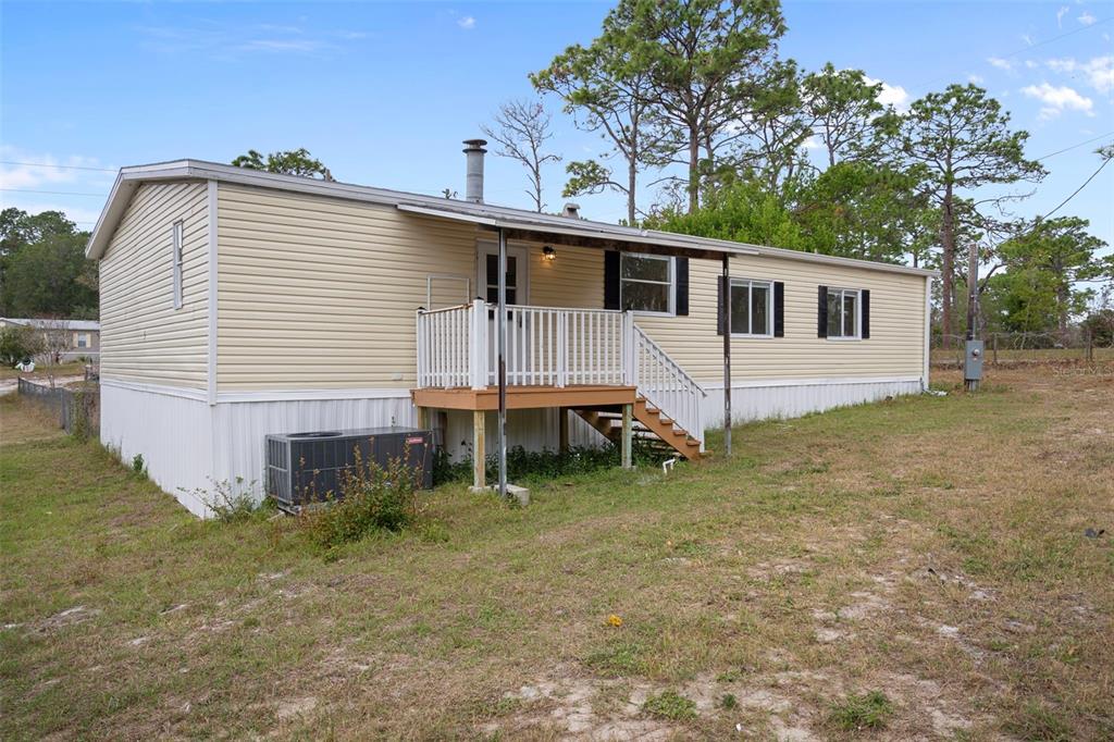 18008 Greensboro Street Spring Hill, FL 34610 - Photo 47 of 49 a view of a house with a backyard