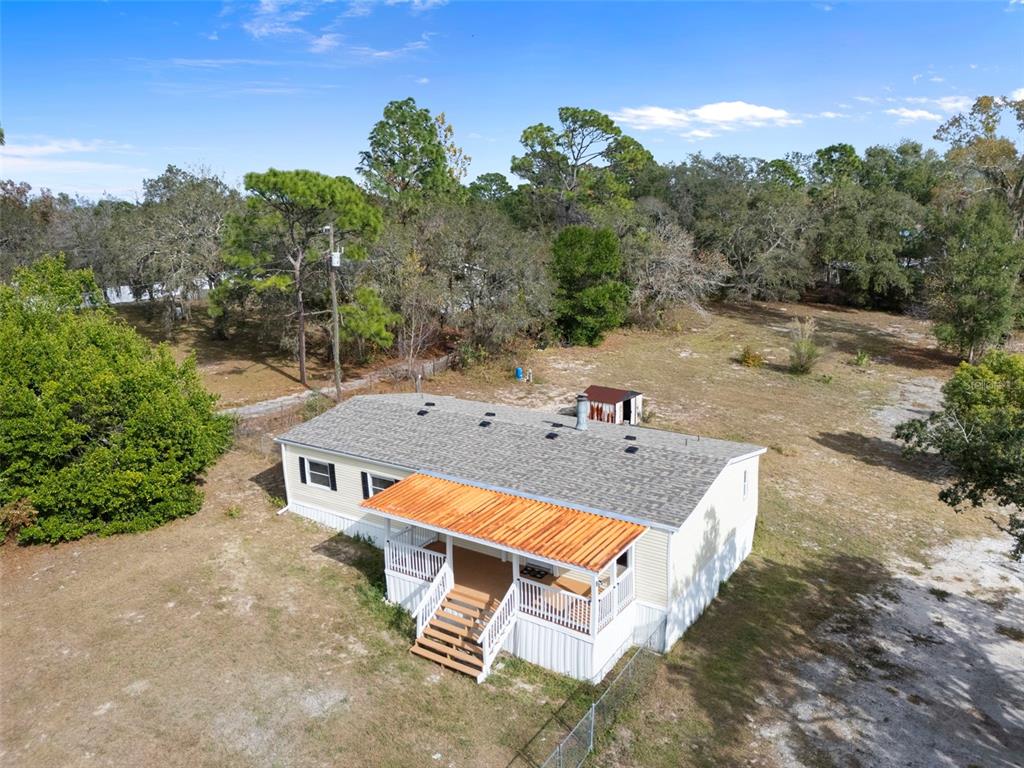 18008 Greensboro Street Spring Hill, FL 34610 - Photo 5 of 49 an aerial view of a house with swimming pool and mountain view