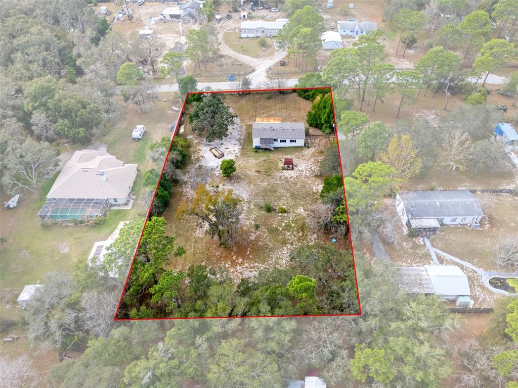 18008 Greensboro Street Spring Hill, FL 34610 - Photo 8 of 49 an aerial view of residential houses with outdoor space