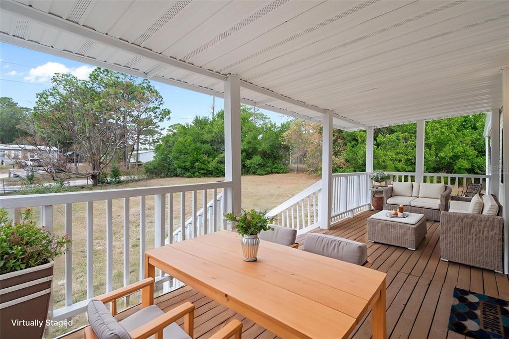 18008 Greensboro Street Spring Hill, FL 34610 - Photo 9 of 49 a view of a patio with a table chairs and a table