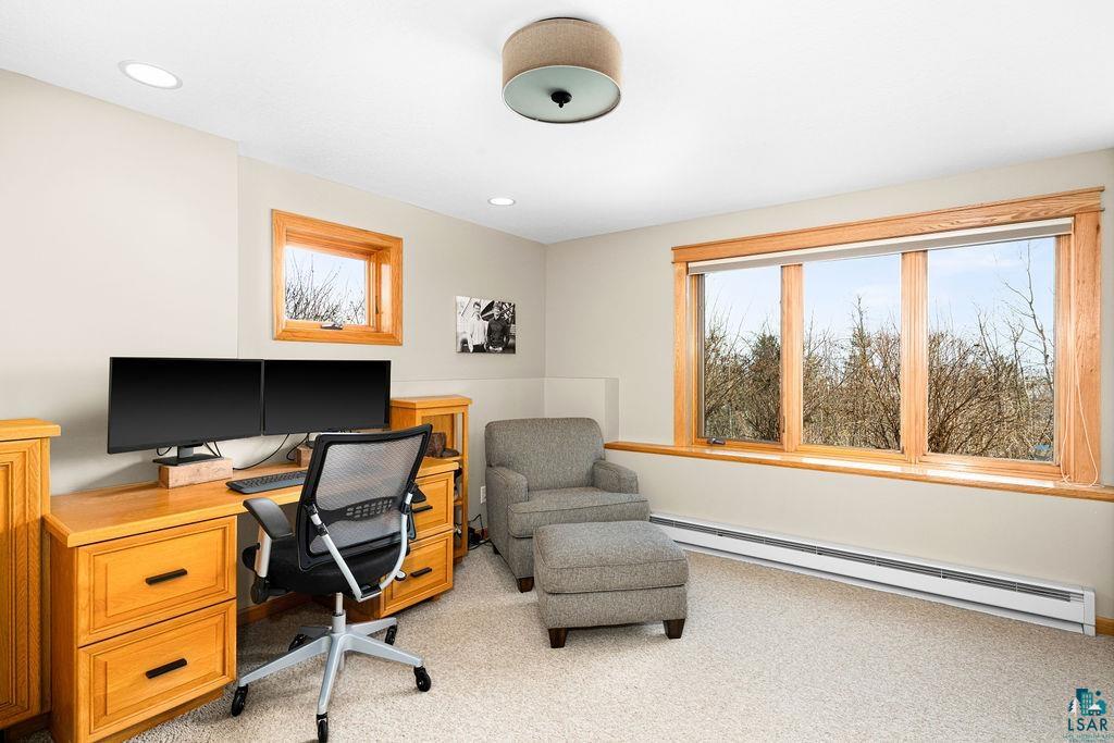 4856 Kingston Street Duluth, MN 55804 - Photo 44 of 88 Room featuring a large triple-pane window, a smaller single-pane window, wood window frames, recessed ceiling lighting, and a flush-mount ceiling fixture