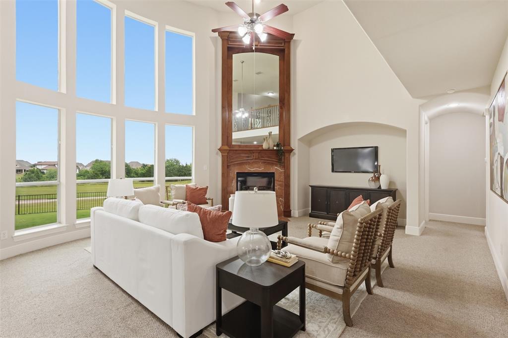 2841 Meadow Ridge Drive Prosper, TX 75078 - Photo 9 of 40 a living room with furniture and a large window