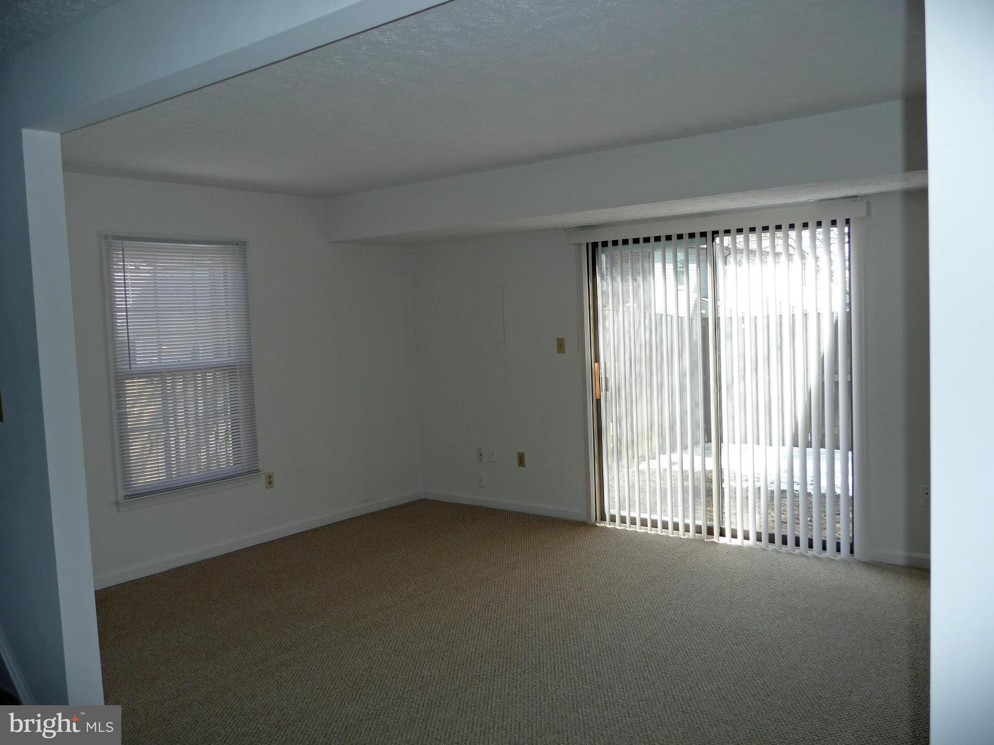 6022 Independence Way Alexandria, VA 22312 - Photo 11 of 26 Living Room w/Access To Fenced Rear Yard