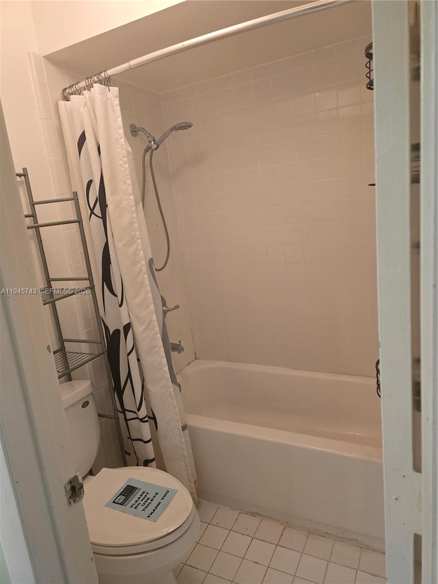 1322 Sandpiper Boulevard, Unit 1 Homestead, FL 33034 - Photo 12 of 25 a bathroom with a toilet and a shower