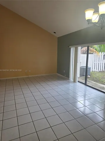a kitchen with a sink a stove and cabinets
