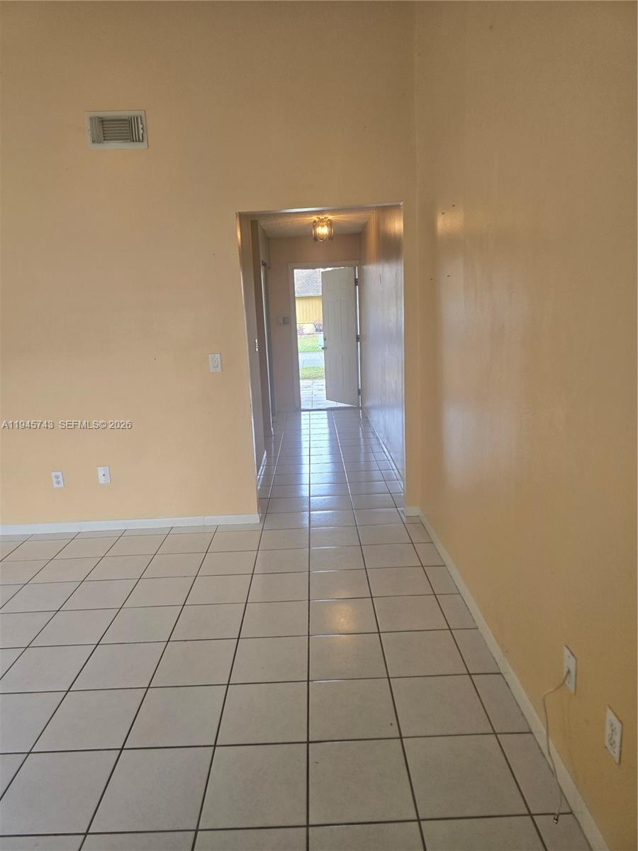 1322 Sandpiper Boulevard, Unit 1 Homestead, FL 33034 - Photo 24 of 25 a view of an empty room and window