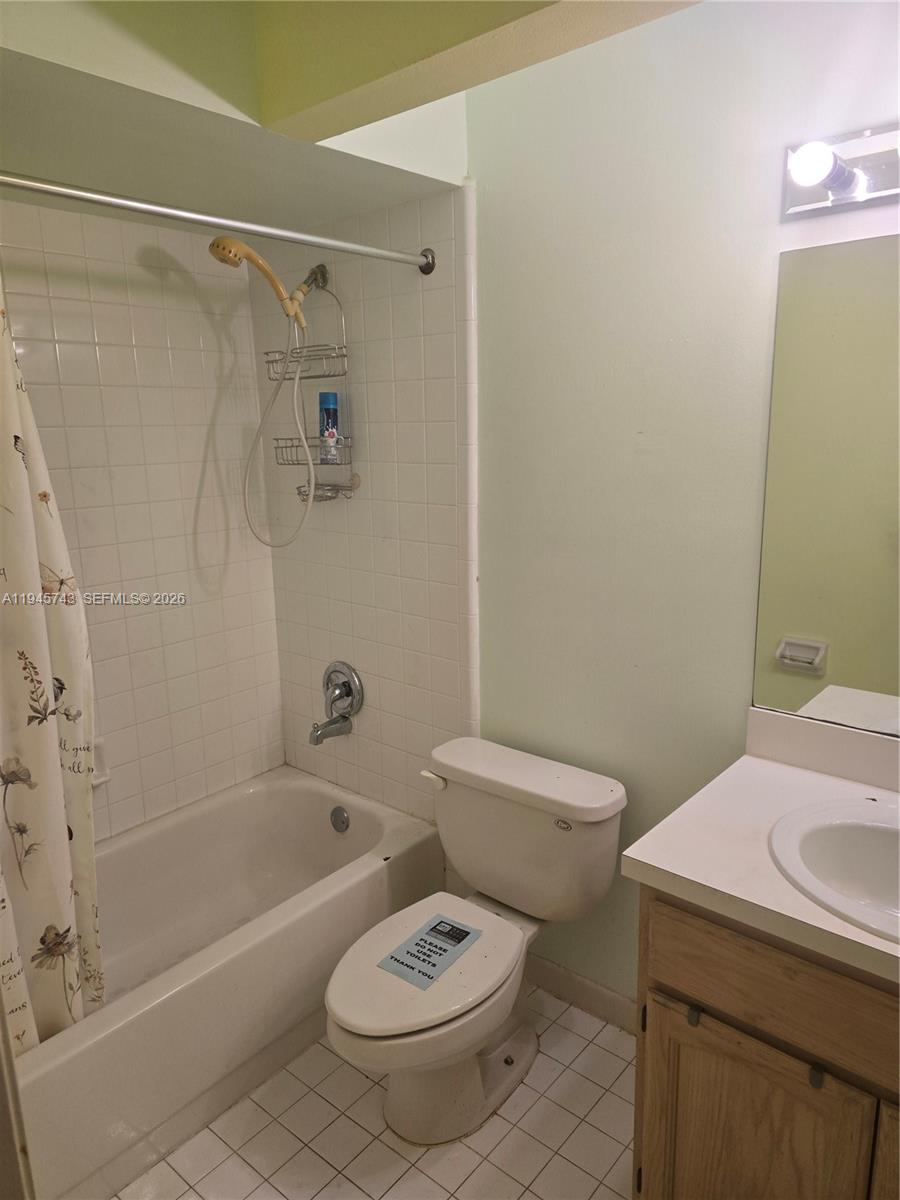 1322 Sandpiper Boulevard, Unit 1 Homestead, FL 33034 - Photo 8 of 25 a bathroom with a sink a toilet and a bathtub