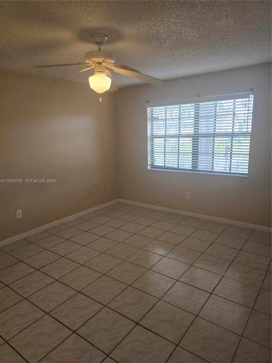 1322 Sandpiper Boulevard, Unit 1 Homestead, FL 33034 - Photo 9 of 25 an empty room with a window