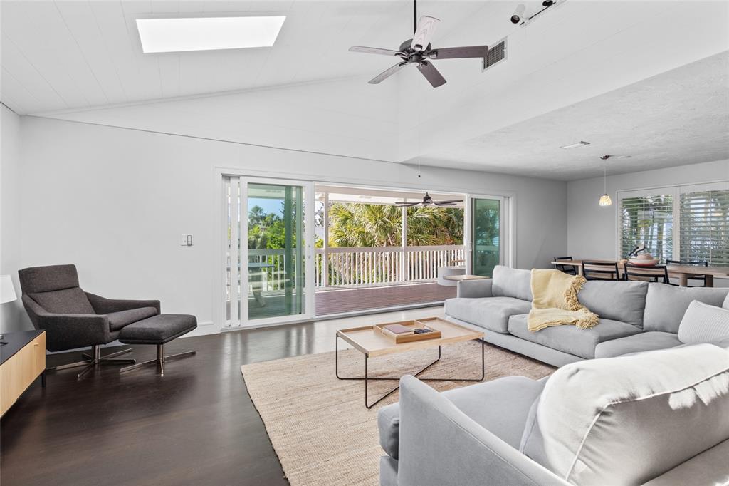 315 Spring Avenue Anna Maria, FL 34216 - Photo 7 of 63 a living room with furniture and a large window