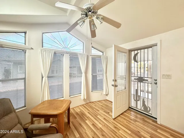 a view of a livingroom with furniture and windows