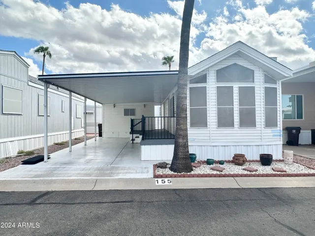 a front view of a house with garage