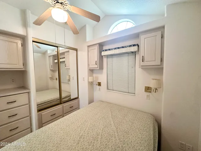 a view of a kitchen with a sink and cabinets