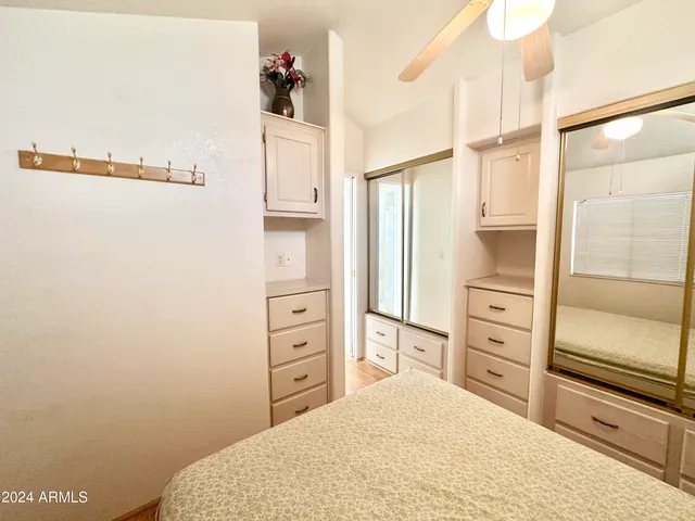 a white refrigerator freezer and a stove sitting inside of a kitchen
