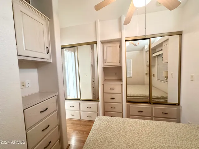 a white toilet sitting next to a bathroom sink