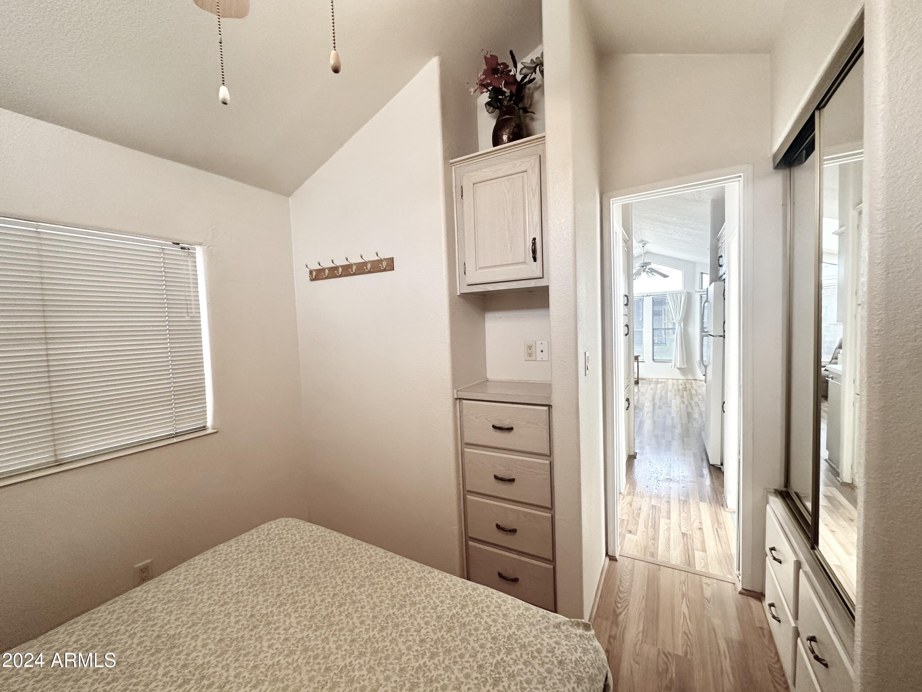 155 South Limestone Drive Apache Junction, AZ 85119 - Photo 30 of 47 a bedroom with a bed and a dresser