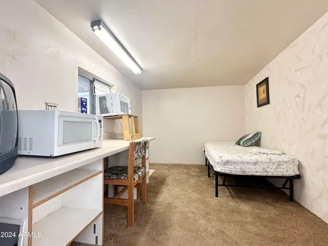a view of a dinning table and chairs in patio