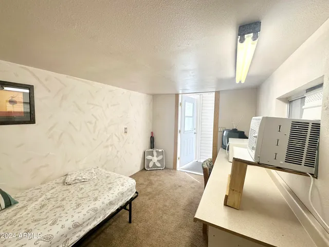 a front view of a house with a yard and fountain