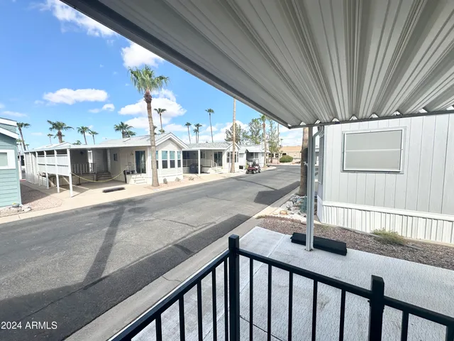 a view of a porch and garden