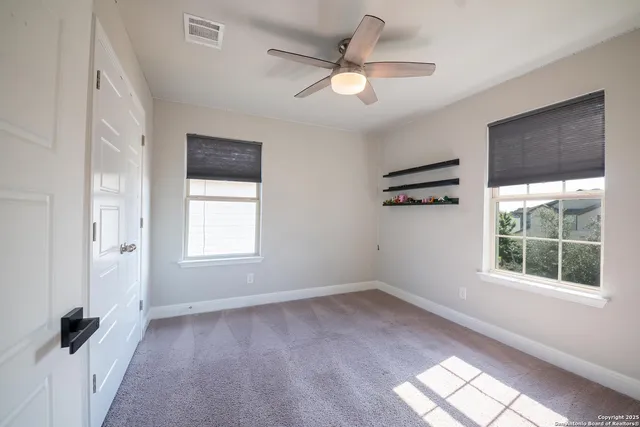 a view of a patio with couches and potted plants