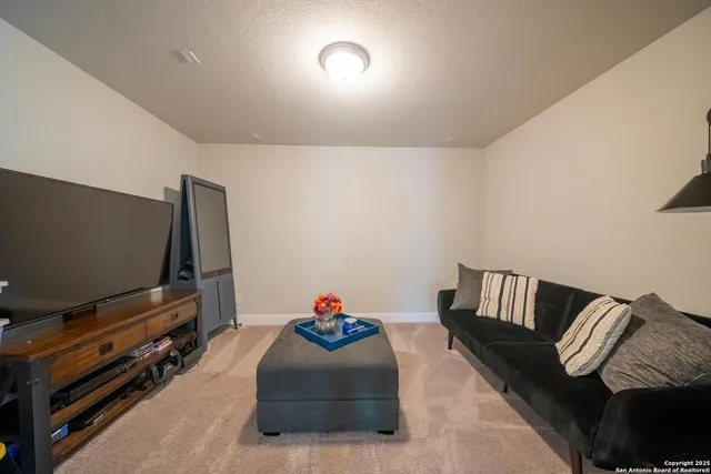 a view of a patio with couches and potted plants