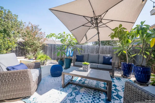 a outdoor living space with furniture and a potted plant