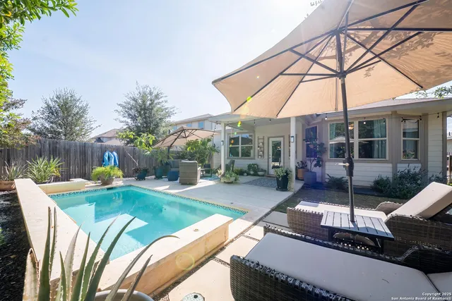 a view of a swimming pool with a patio