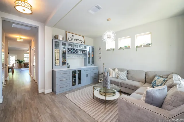 a living room with furniture and a large window