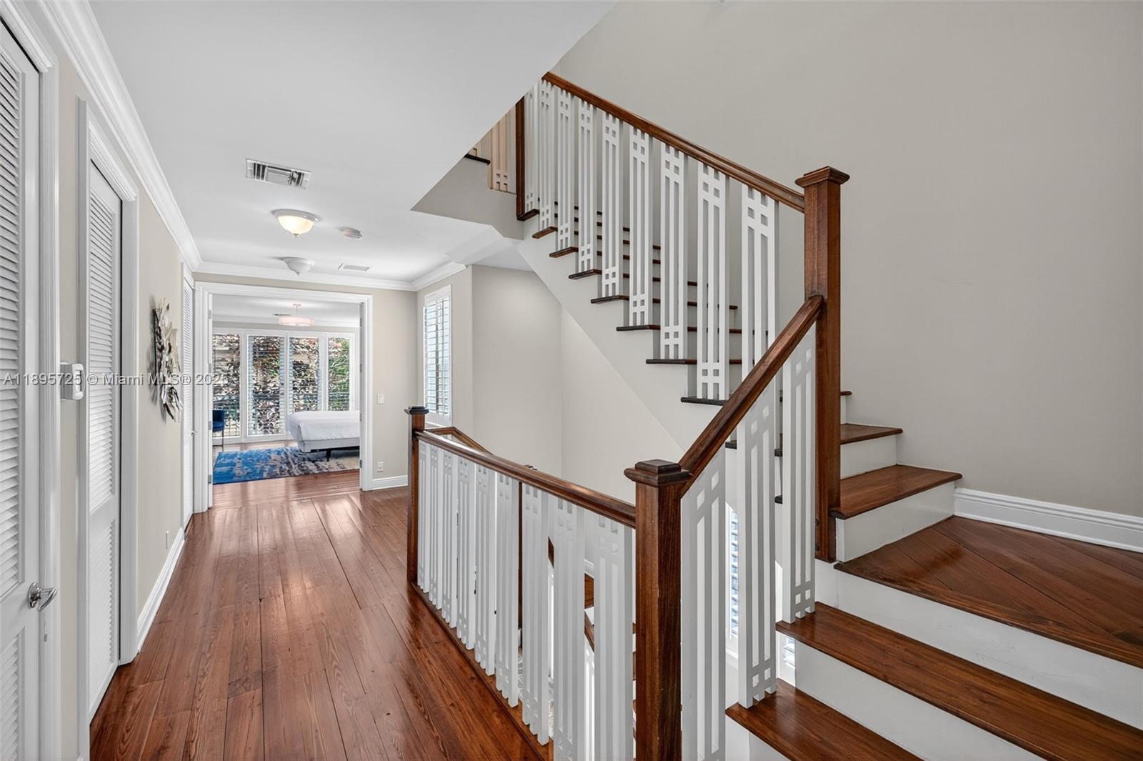 312 Northeast 12th Avenue Fort Lauderdale, FL 33301 - Photo 11 of 39 a view of staircase with wooden floor and fan