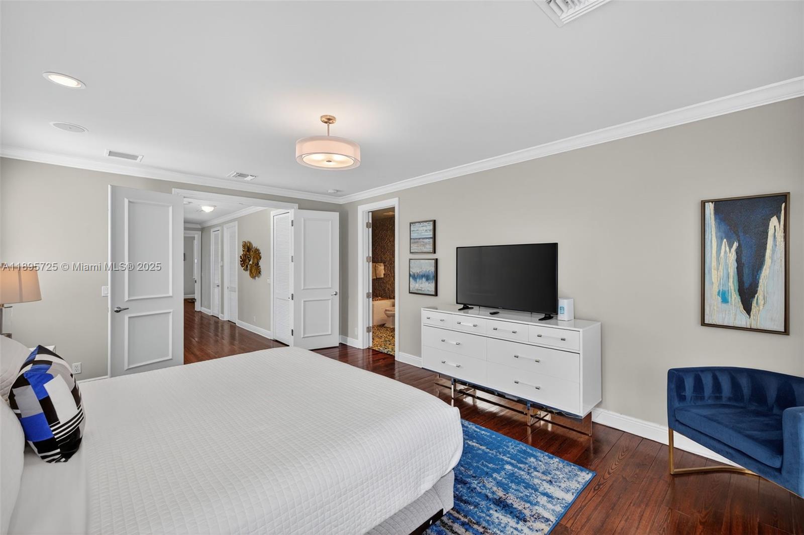 312 Northeast 12th Avenue Fort Lauderdale, FL 33301 - Photo 14 of 39 a bedroom with a bed and a flat screen tv