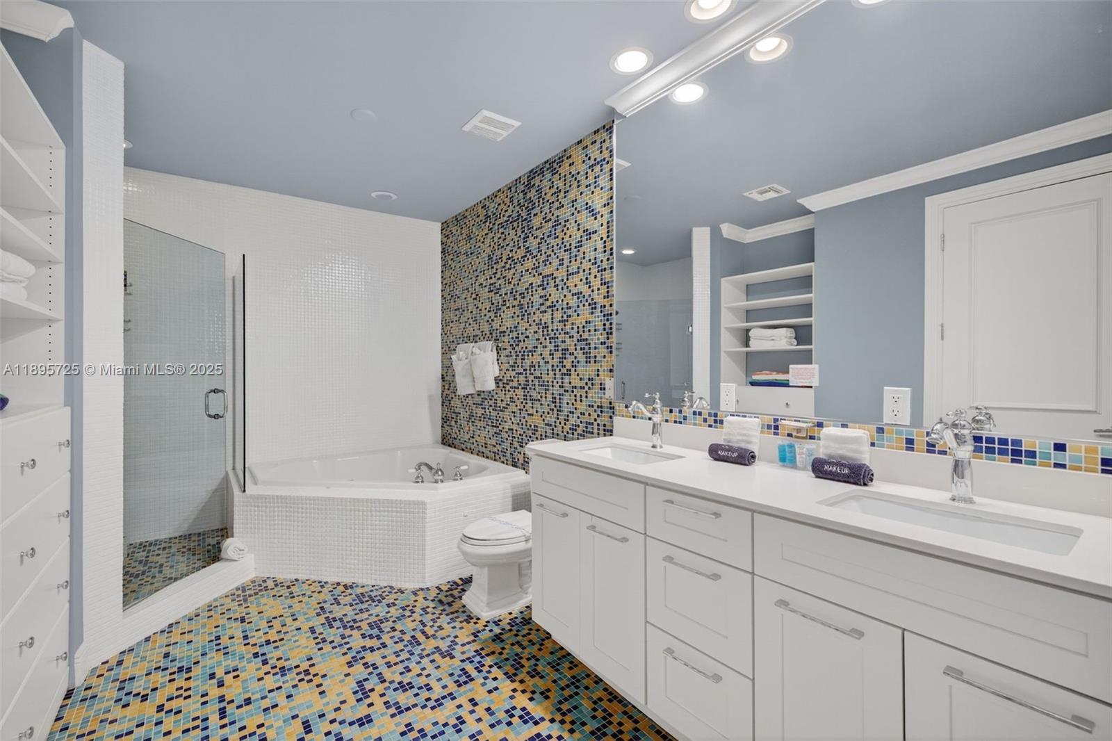 312 Northeast 12th Avenue Fort Lauderdale, FL 33301 - Photo 15 of 39 a bathroom with a double vanity sink toilet mirror and bathtub