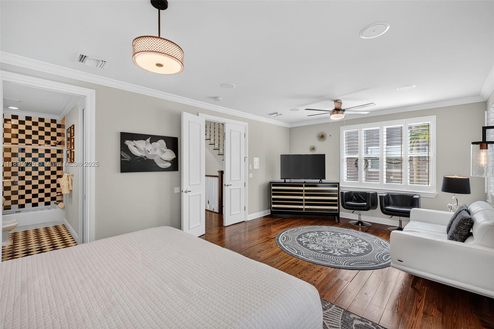 312 Northeast 12th Avenue Fort Lauderdale, FL 33301 - Photo 20 of 39 a bedroom with a bed and wooden floor