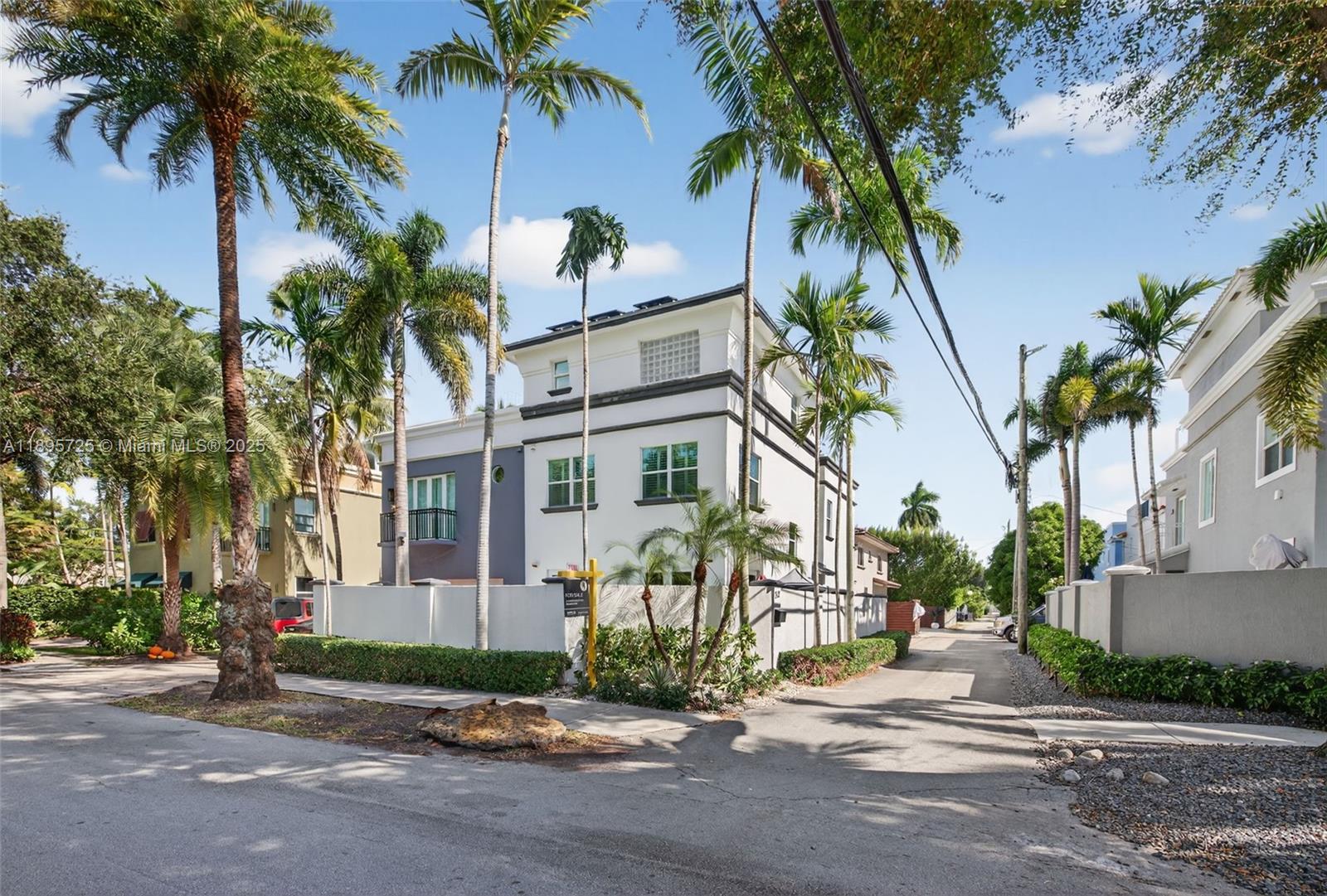312 Northeast 12th Avenue Fort Lauderdale, FL 33301 - Photo 2 of 39 a front view of multiple houses with yard