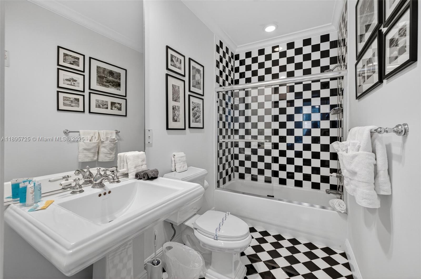 312 Northeast 12th Avenue Fort Lauderdale, FL 33301 - Photo 21 of 39 a bathroom with a sink a toilet and shower curtain