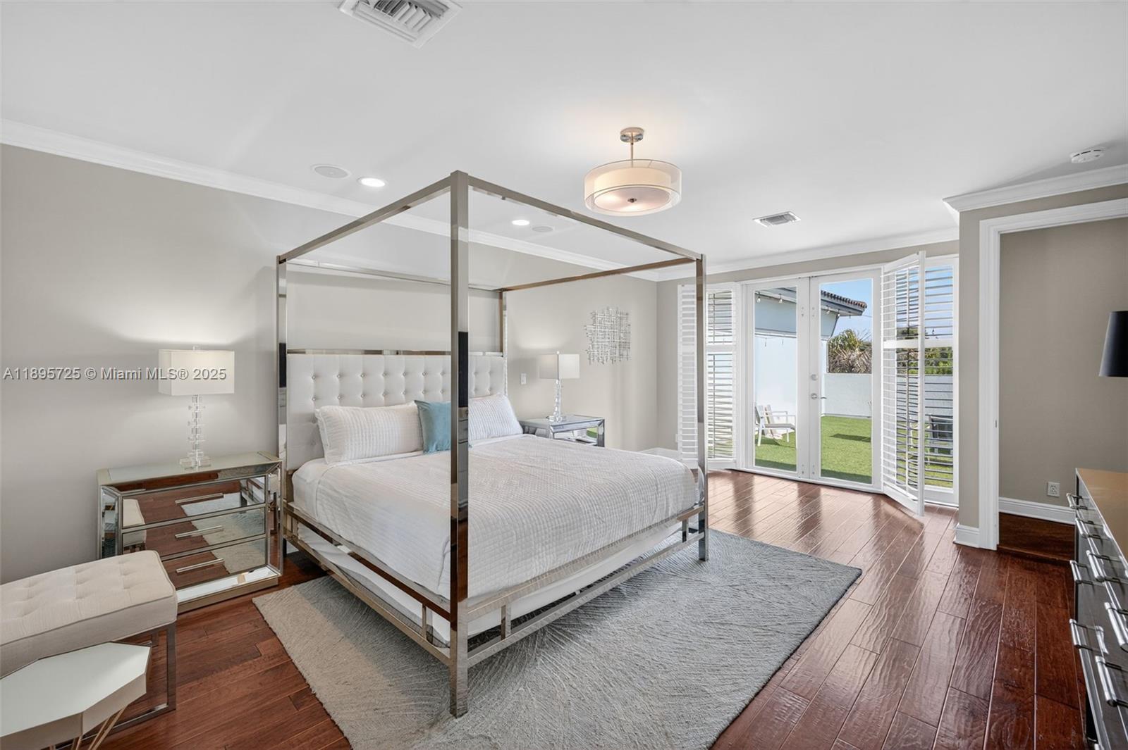 312 Northeast 12th Avenue Fort Lauderdale, FL 33301 - Photo 22 of 39 a bedroom with a bed and wooden floor