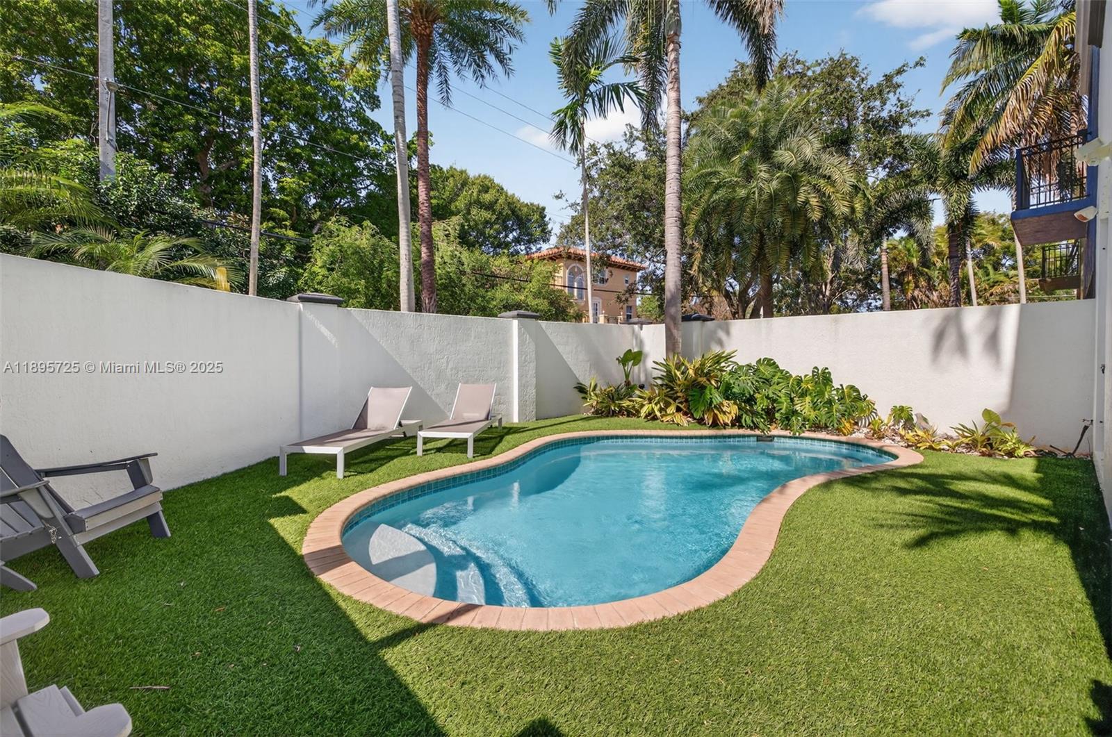 312 Northeast 12th Avenue Fort Lauderdale, FL 33301 - Photo 31 of 39 a view of a swimming pool with a yard