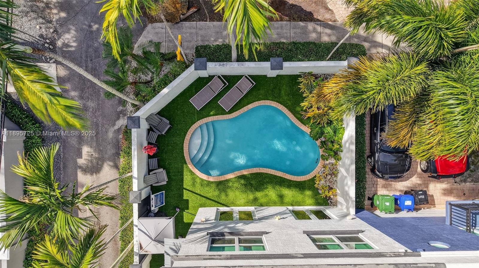 312 Northeast 12th Avenue Fort Lauderdale, FL 33301 - Photo 39 of 39 an aerial view of a swimming pool with a garden and plants