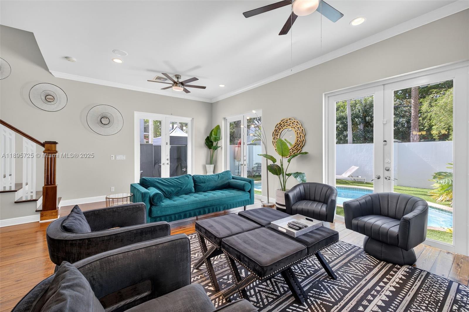 312 Northeast 12th Avenue Fort Lauderdale, FL 33301 - Photo 4 of 39 a living room with furniture a chandelier fan and a window