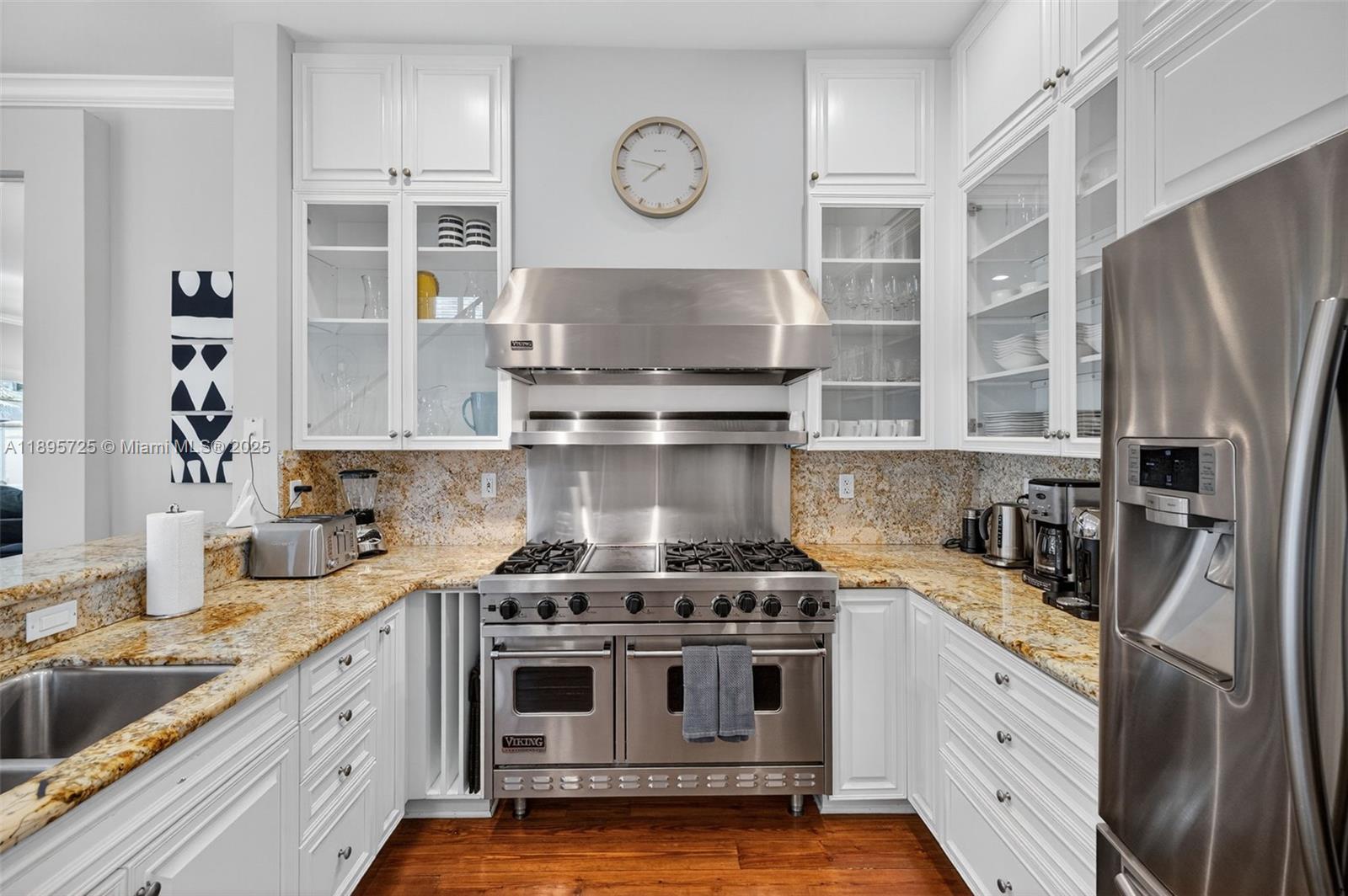 312 Northeast 12th Avenue Fort Lauderdale, FL 33301 - Photo 8 of 39 a kitchen with stainless steel appliances granite countertop a stove and a sink