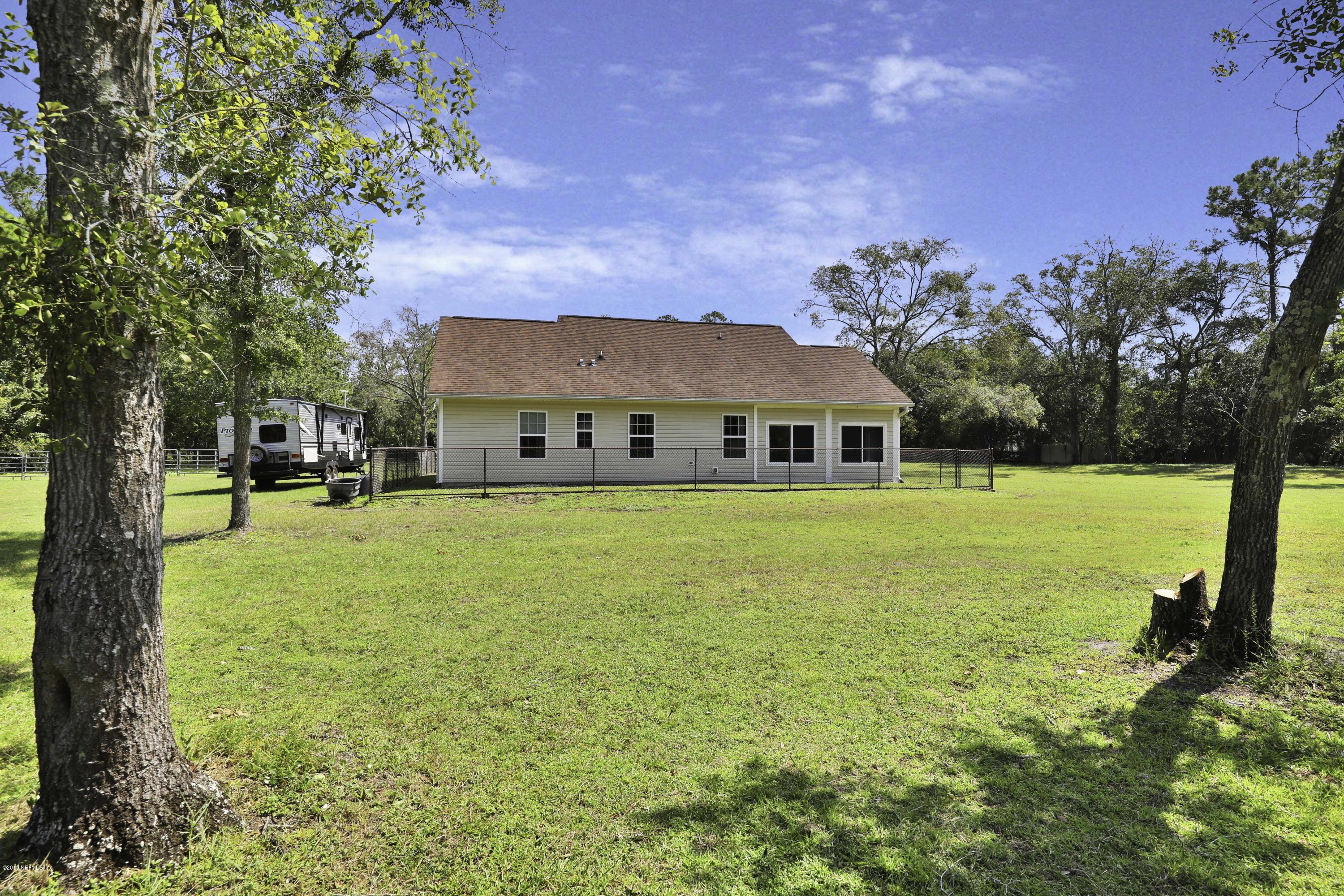 1405 Roberts Road St. Johns, FL 32259 - Photo 21 of 27 a front view of a house with a yard
