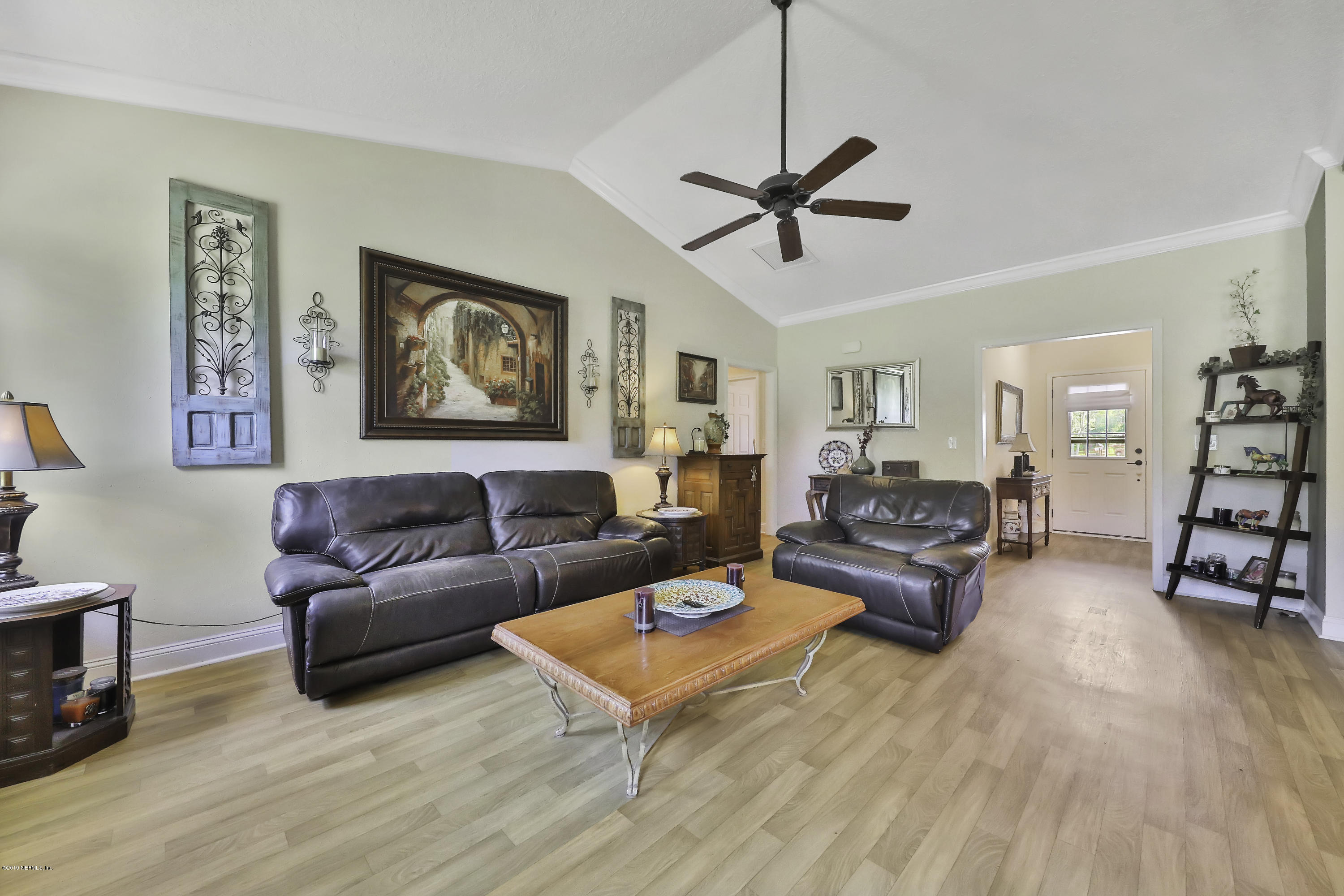 1405 Roberts Road St. Johns, FL 32259 - Photo 7 of 27 a living room with furniture and wooden floor