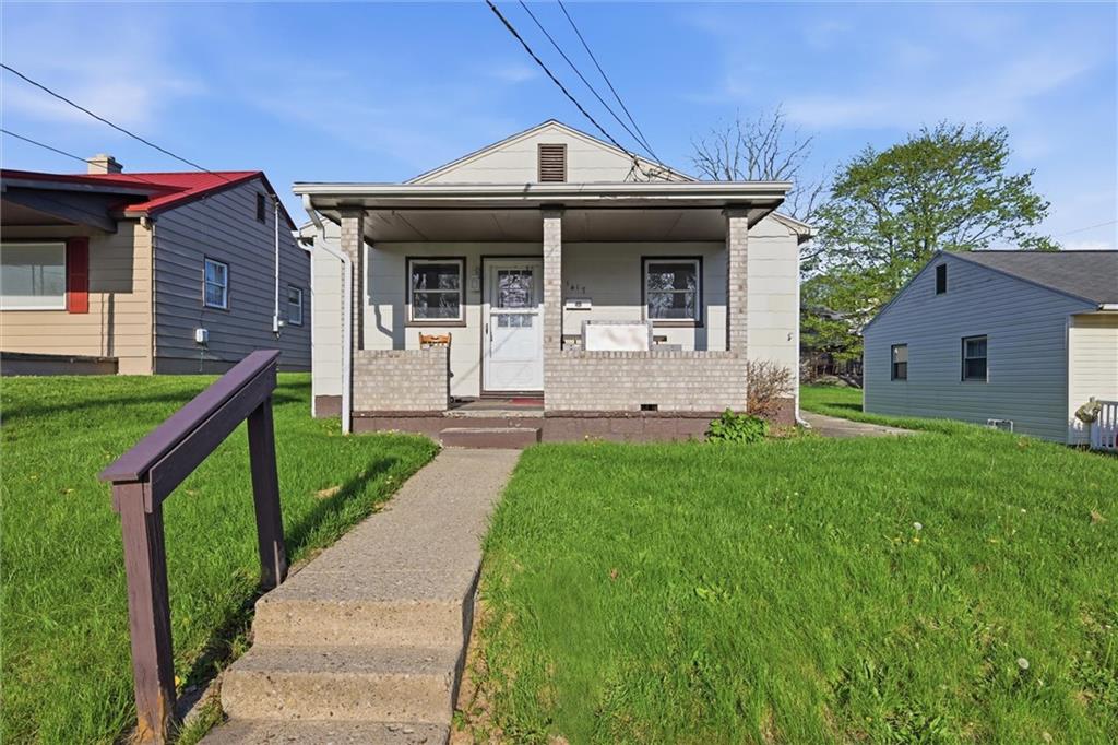 1417 Randolph Street New Castle, PA 16101 - Photo 1 of 15 a front view of a house with a yard