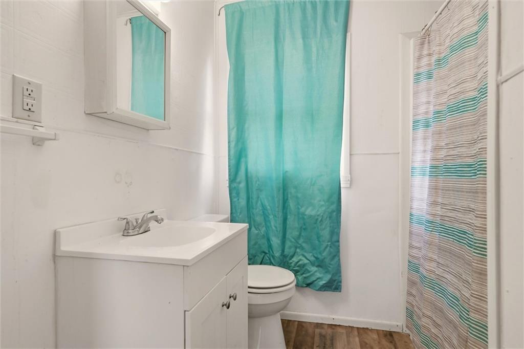 1417 Randolph Street New Castle, PA 16101 - Photo 9 of 15 a bathroom with a sink a toilet and shower
