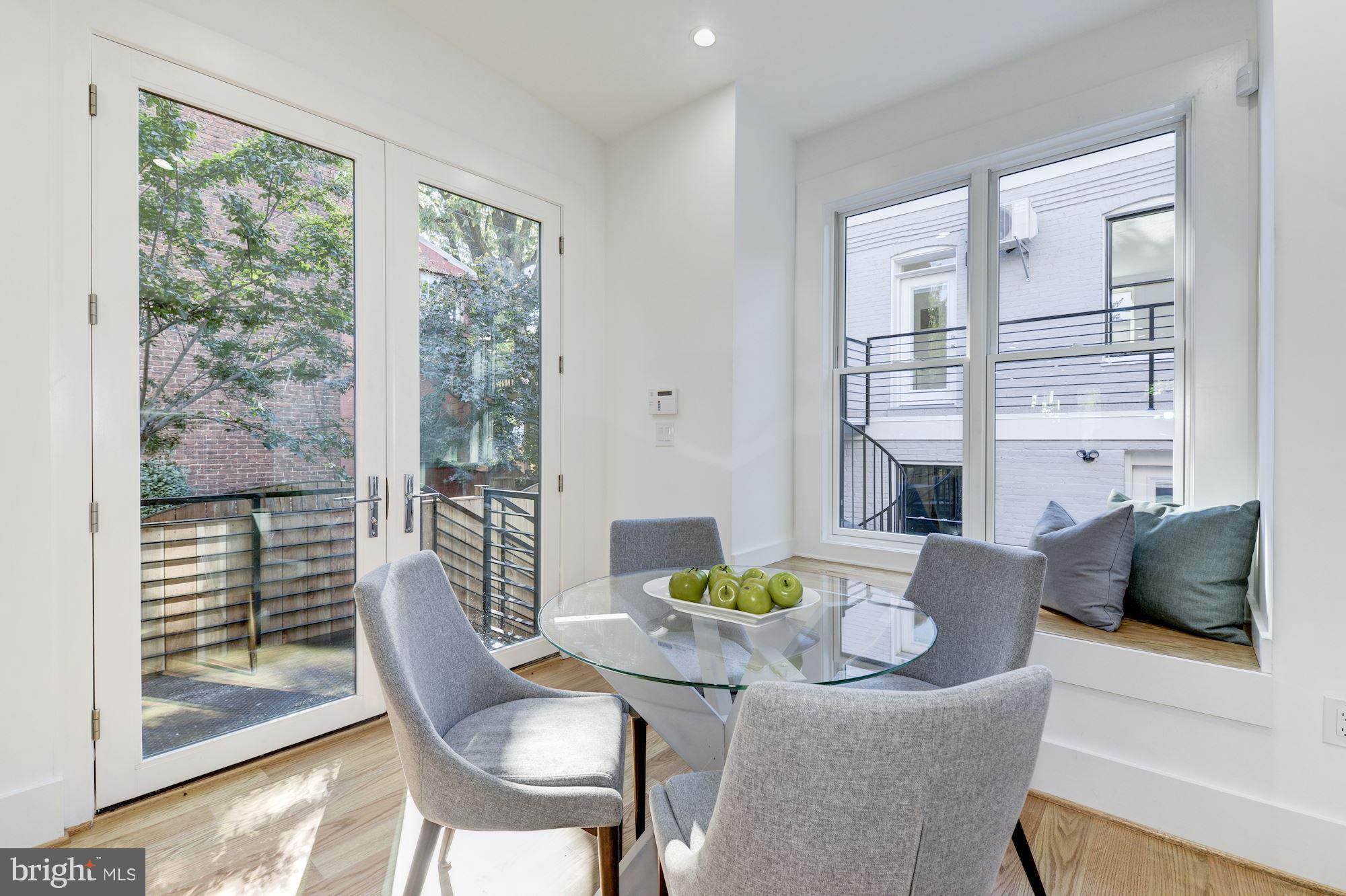 17 7th Street Southeast Washington, DC 20003 - Photo 14 of 29 a view of a dining room with furniture and a window