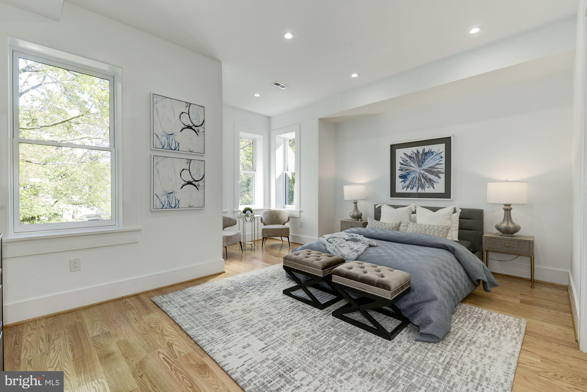 17 7th Street Southeast Washington, DC 20003 - Photo 20 of 29 a bed room with a bed and a window