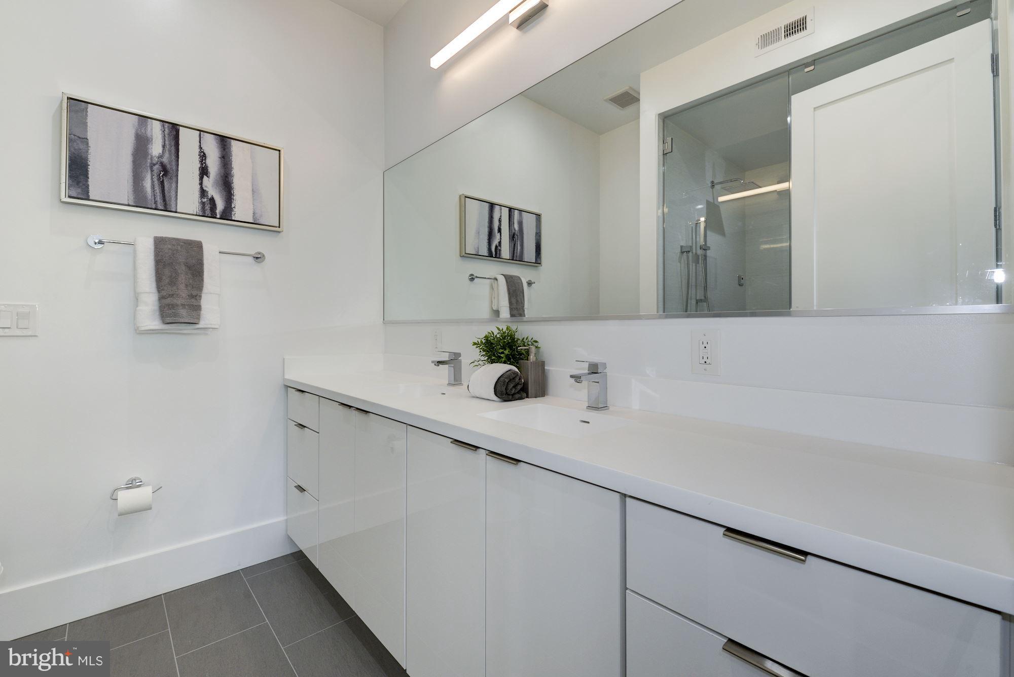 17 7th Street Southeast Washington, DC 20003 - Photo 21 of 29 a bathroom with a sink and a mirror