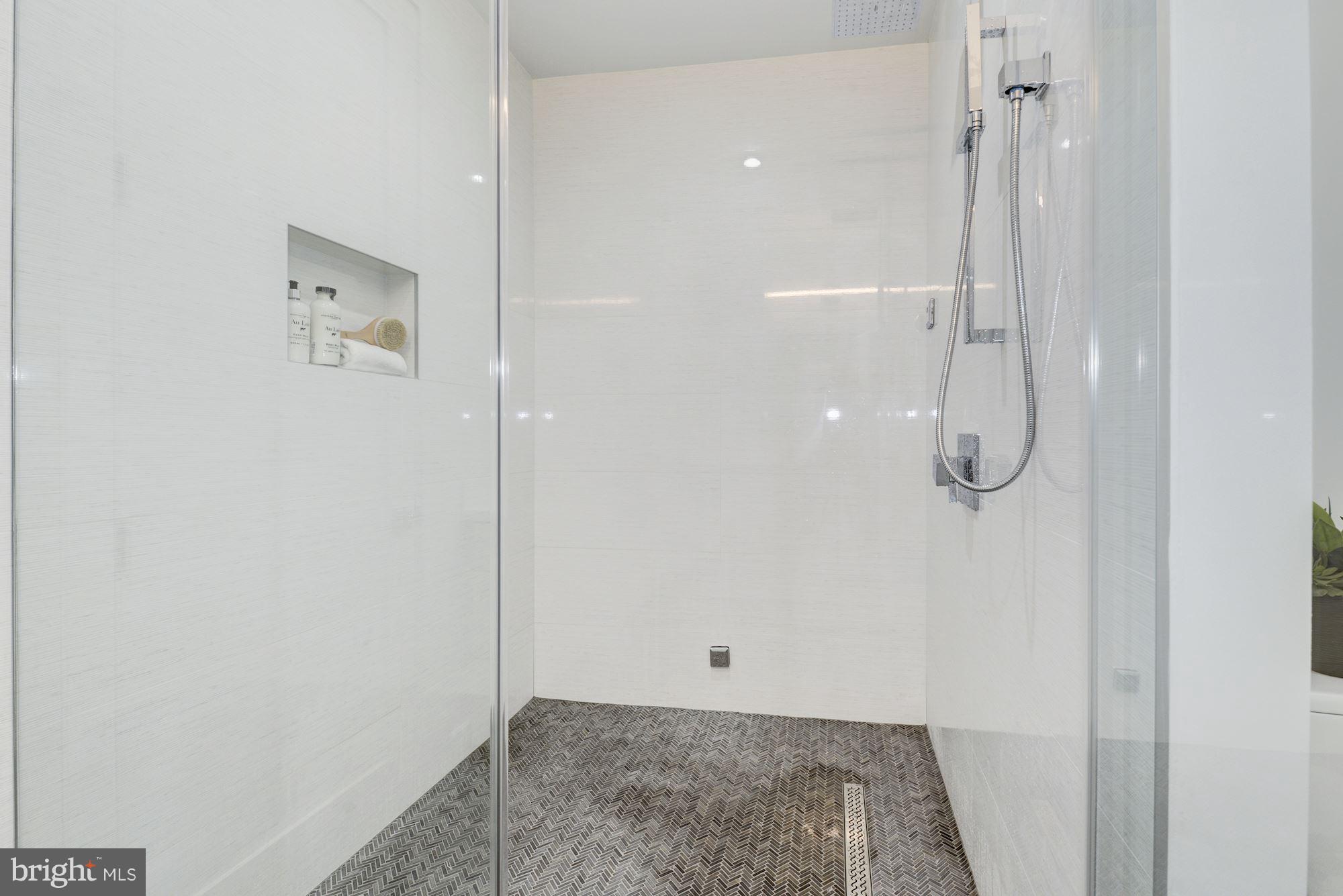 17 7th Street Southeast Washington, DC 20003 - Photo 22 of 29 a bathroom with a glass shower door