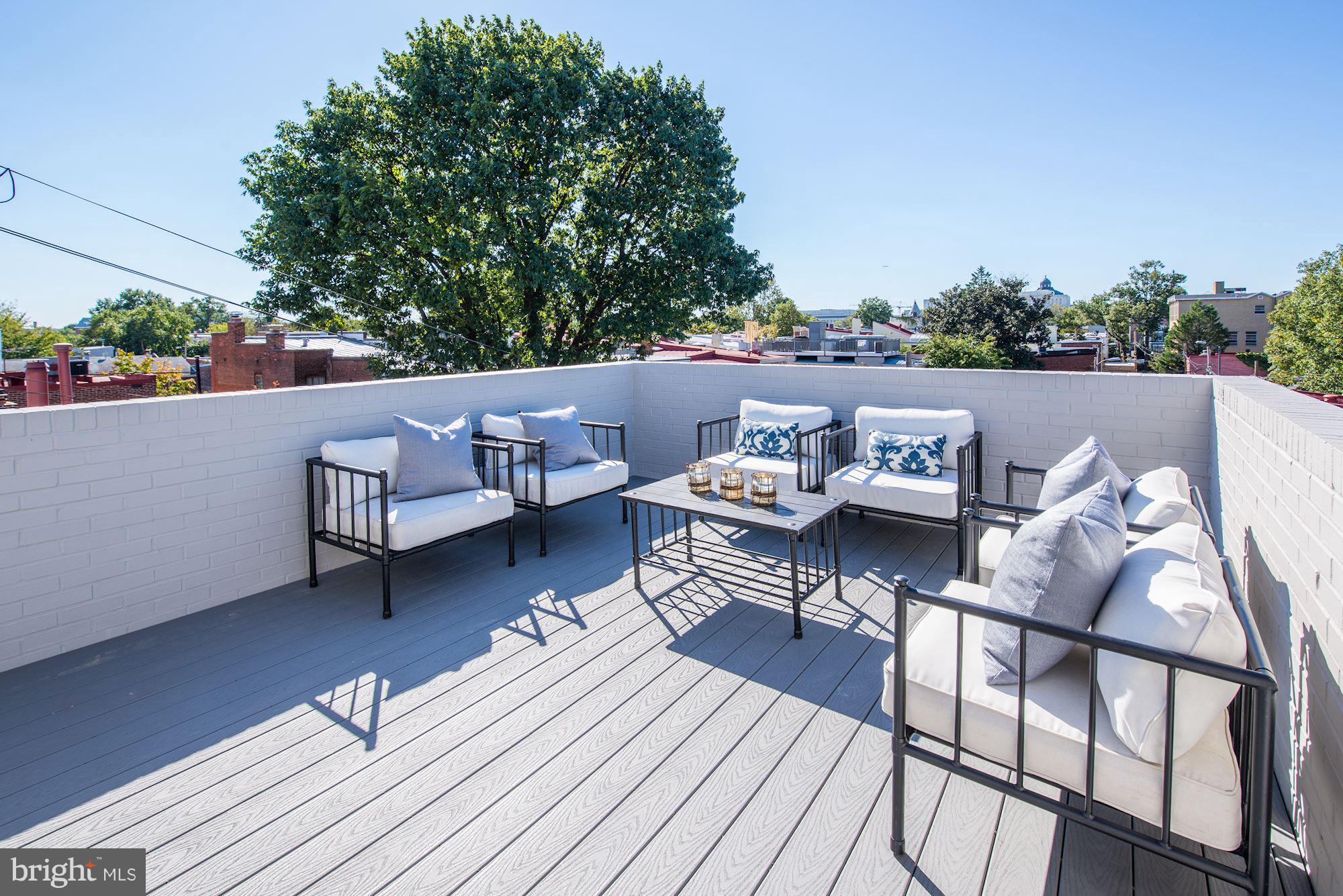 17 7th Street Southeast Washington, DC 20003 - Photo 24 of 29 a terrace with outdoor seating and trees